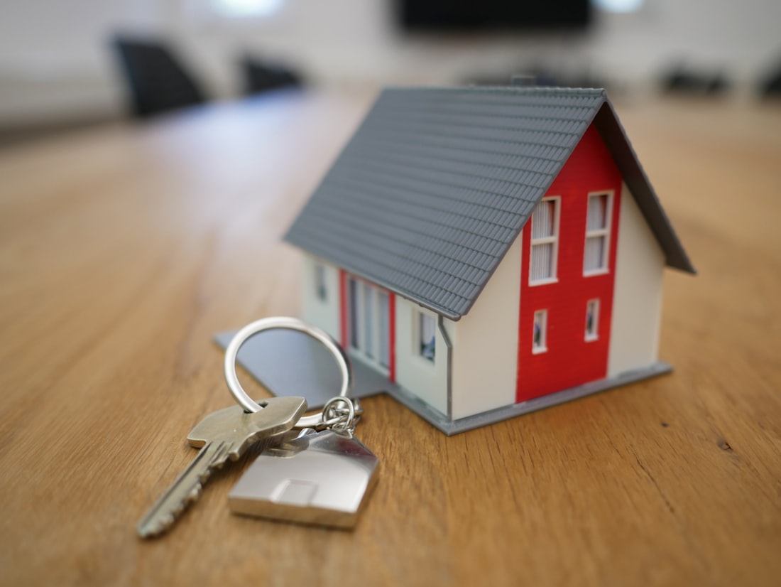 Real estate agent handing keys to a client at a property